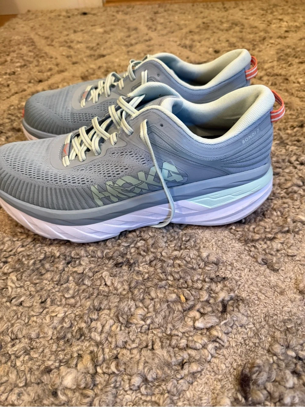 Hoka Pale Gray Running Shoes with orange Accents